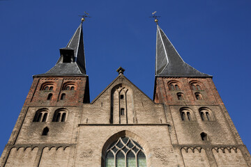 Fototapeta na wymiar The Saint Nicholas Church in Deventer, the Netherlands, against a blue sky