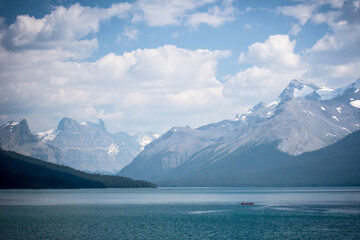 Lake and mountains with single boat