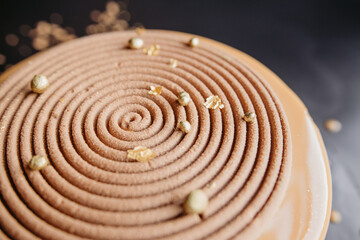 Naklejka premium cream cake on a black background 