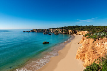 Scenic view of the Alemao Beach (Praia do Alemao) in Portimao, Algarve, Portugal; Concept for summer beach vacations and travel in Portugal