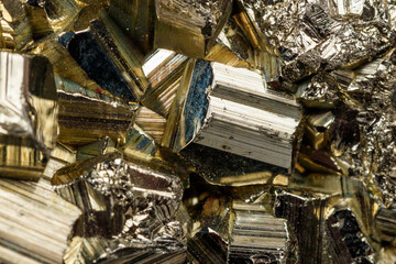 Macro mineral stone Pyrite on a black background