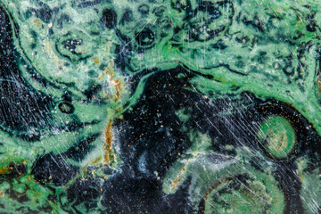 Macro mineral stone jasper kambaba on a white background