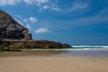 Fototapeta na wymiar Rocks at a sandy beach