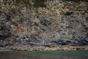 Big textured cliff at the sea