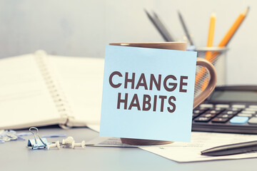 Change Habits - concept of text on sticky note
