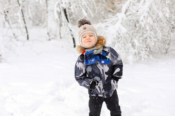 child playing with snow, playing with snow,child playing in winter