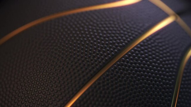 Close up of black basketball ball with golden glowing lines rotating in the dark. Depth of field. 3d rendering