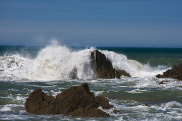 waves crashing on rocks