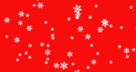Snowflakes falling against red background