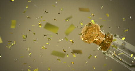 Image of gold confetti falling over champagne being opened