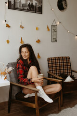 beautiful woman at cozy home with the cat