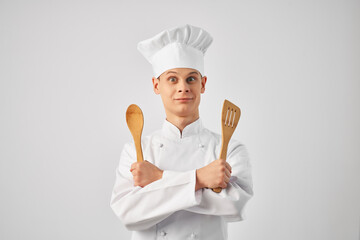 man in chef's uniform cooking work profession