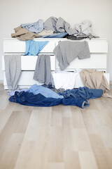 pile of dirty laundry in living room