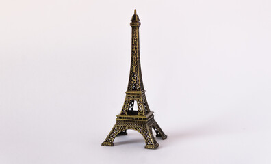 Mattel artificial Eiffel Tower with white background and small reflection on the right