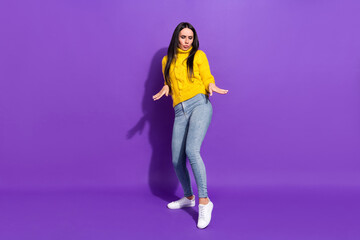 Full body photo of excited satisfied young lady dancing partying isolated on violet color background