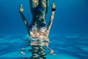 Female diver under water surface