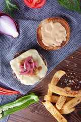 Rustic burger with melted cheese and caramelized onions.