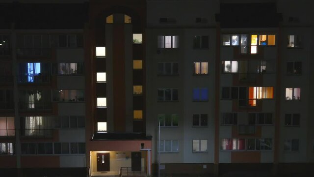 Night time lapse of Light in the windows of a multistory building