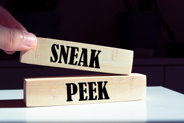 Text Sneak peek on wooden blocks.