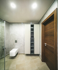Fototapeta na wymiar Modern interior of bathroom. Wooden door. Empty shelves.