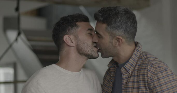 Hispanic gay couple in love at home