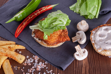 Chicken burger and fresh vegetables.