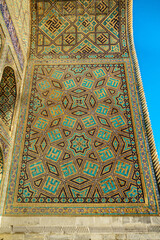 Eastern patterns of madrasah entrance portal, example of Central Asian architecture. Madrasah Ulugh Beg in Samarkand, Uzbekistan, XV century