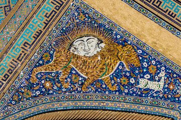Details of the facade of the madrasah. Lion hunting scene. Sher-Dor Madrasah in Samarkand,...