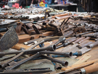 Second-hand flea market selling mechanic equipment, counter knives, grass clippers. Hand tools drill cheap price