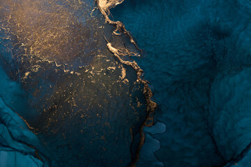 Luxury abstract background in alcohol ink technique, indigo blue gold liquid painting, scattered...