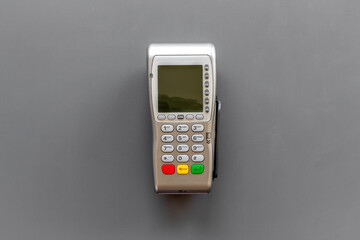 Payment by credit card with POS terminal, top view. E-commerce and payment concept