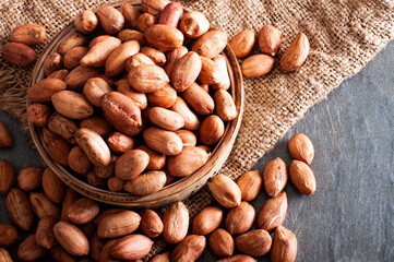 Unshelled and healthy peanuts, black backround