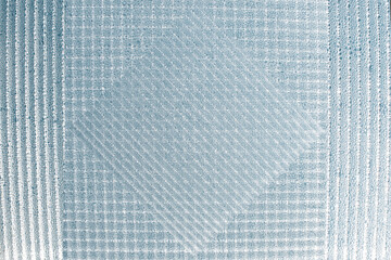 square rhombus and rectangle layered on top of each other with a pattern of drops-light blue background