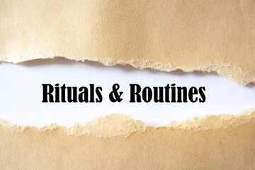 rituals and routines written under torn paper.