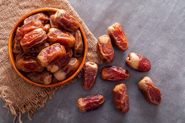 Black stone table and dried dates on it.