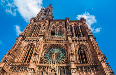 Lovely low angle shot of the west front of the famous Strasbourg Cathedral de Notre-Dame. The...