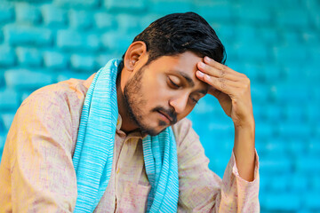 Young indian farmer in depression.