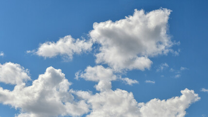 Naklejka na ściany i meble White clouds in the blue sky panorama