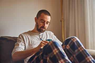 Front view of a pensive middle-aged man writing