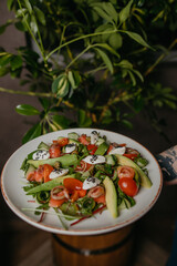 salad with salmon, avocado and cheese
