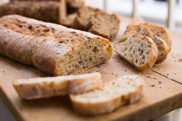 fresh loaf of bread on wooden board