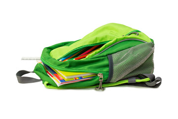 green school backpack with books, pencils and a chalkboard isolated on white, back to school