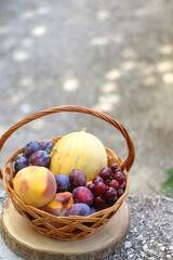 Vintage basket filled with various fruit. Selective focus.