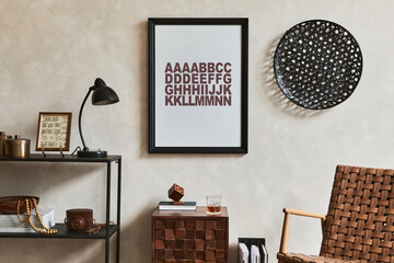 Stylish interior design composition of elegant masculine living room with mock up poster frame, brown armchair, industrial geometric shelf and personal accessories. Template.