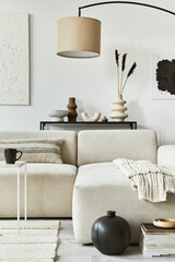 Creative interior composition of cozy living room with mock up poster frame and structure painting,...