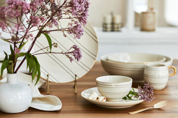 Creative composition of elegant dining room interior with classy porcelain and beautiful personal accessories. Luxury apartments. Beauty in the details. Template.