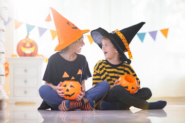 Kids in witch costume on Halloween trick or treat