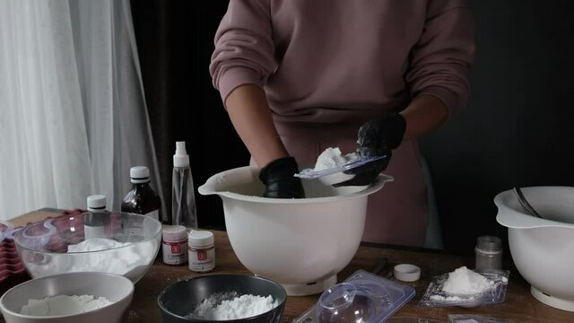 handmade bath bombs process. Preparation of bath bombs. Ingredients and floral decor on a wooden vintage table.