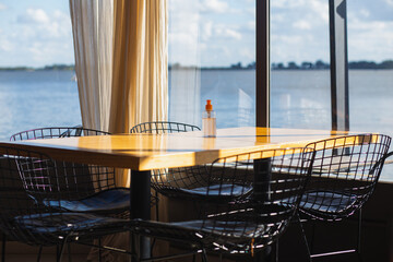 Empty table in a cafe overlooking Lake Chaskomus