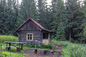 Wooden hut is a tourist shelter in the Ukrainian Carpathians, surrounded by high mountains and forests. Tourism and wildlife concept